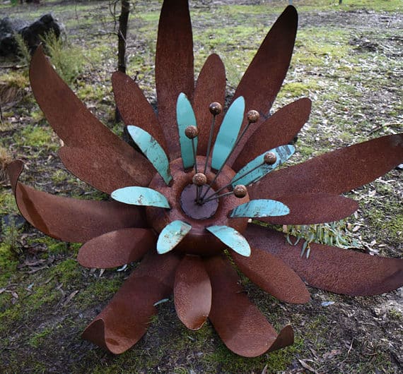 Aqua and rust scrap metal sculpture flower, Tread Sculptures