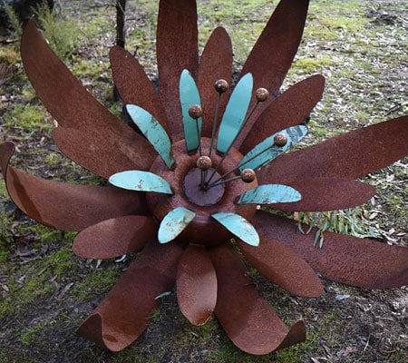 Scrap metal flower garden art, Tread Sculptures