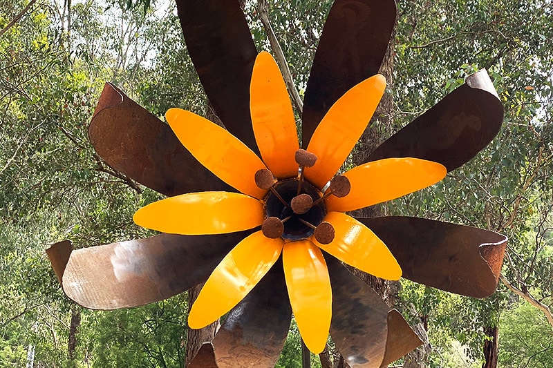 Vibrant upcycled flower garden art handmade by Tread Sculptures in Melbourne, Australia