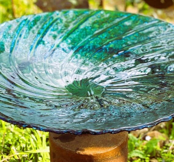 Recycled clear birdbath handmade by Tread Sculptures and Rob Hayley in Melbourne, Australia