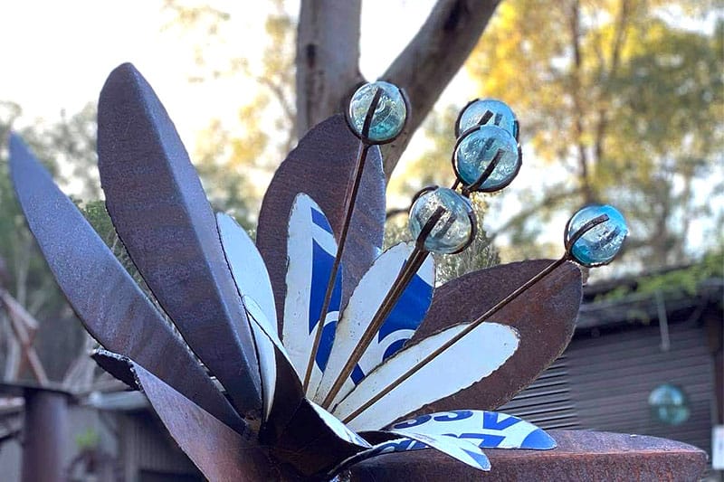 Outdoor scrap metal flower art made from recycled materials by Tread Sculptures in Melbourne, Australia