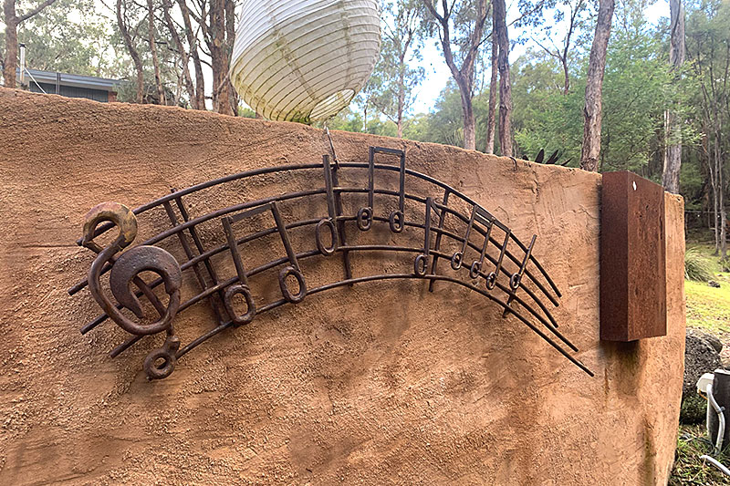 Quirky treble clef sculpture made from recycled metals. Handmade by Tread Sculptures in Melbourne, Australia