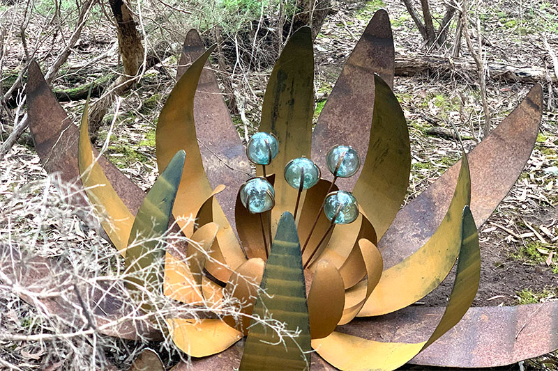 Rusty ground flower made from scrap metals by Tread Sculptures in Melbourne, Australia