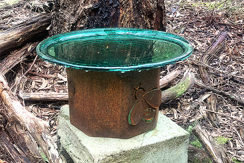Rusty bollard waterer made from recycled materials by Tread Sculptures in Melbourne, Australia