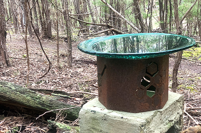 Rusty bollard waterer made from recycled materials by Tread Sculptures in Melbourne, Australia