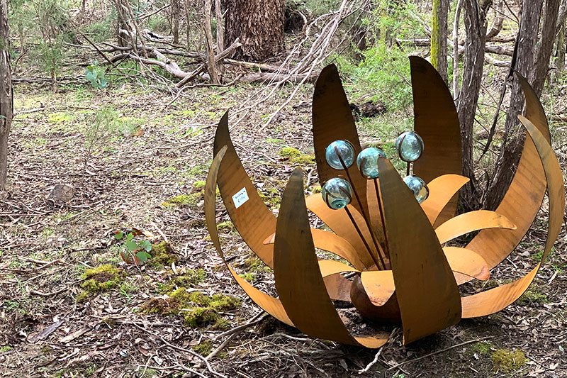 Rusty ground flower handmade by Tread Sculptures in Melbourne, Australia