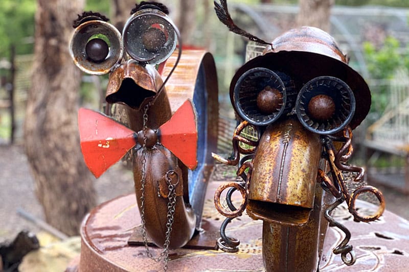Couple snail sculptures made from reclaimed materials by Tread Sculptures and glass artists Rob Hayley n Melbourne, Australia