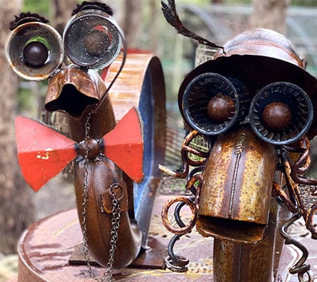 Couple rCouple snail sculptures made from reclaimed materials by Tread Sculptures and glass artists Rob Hayley n Melbourne, Australia