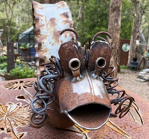 Rusty snail sculpture made from reclaimed steel by Tread Sculptures