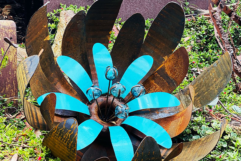 Reclaimed metal ground flower sculpture made in Melbourne, Australia