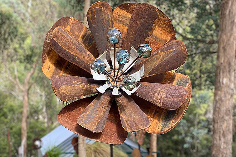 Sculptural metal flower made from reclaimed materials by Tread Sculptures