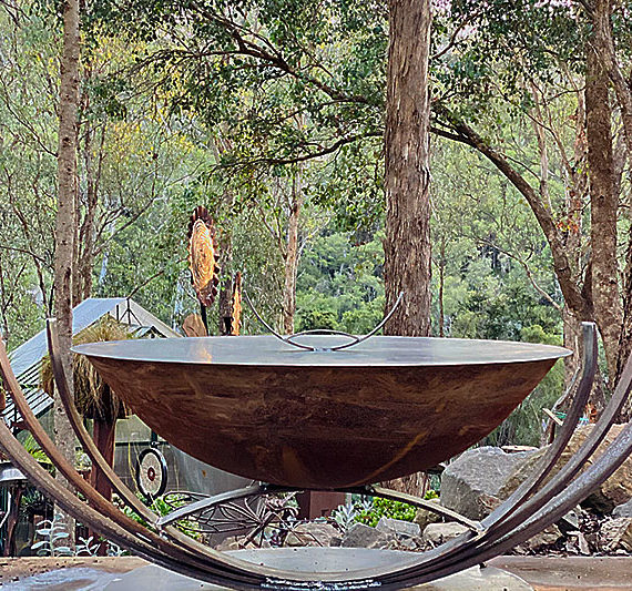 Reclaimed metal firepit made from recycled materials by Tread Sculptures