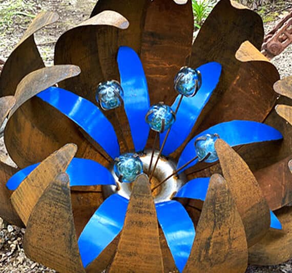 Scrap metal ground flower handmade by Tread Sculptures in Melbourne, Australia