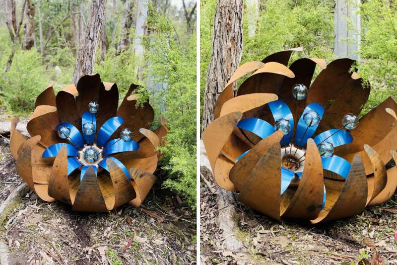 Huge blue rusty ground flower made from recycled materials