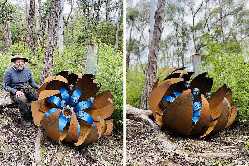 Huge blue rusty ground flower made from recycled materials