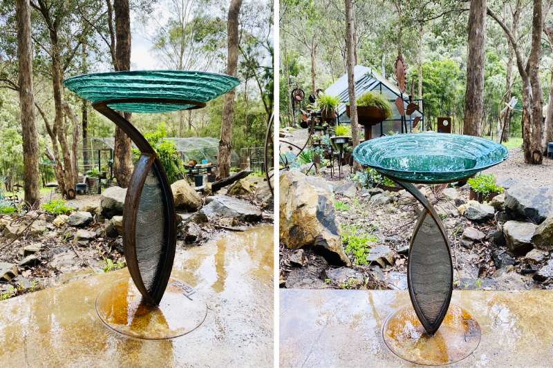 Glass birdbath sculpture made from reclaimed materials