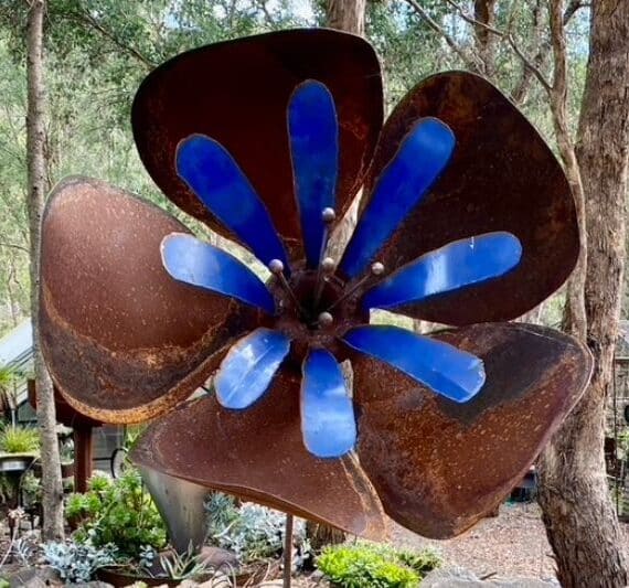 This Blue Poppy is full of life with big gentle petals a pop of blue from an old drum and ball bearing stamens.