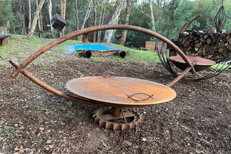 Scrap metal firepit made from recycled materials created by Tread Sculptures