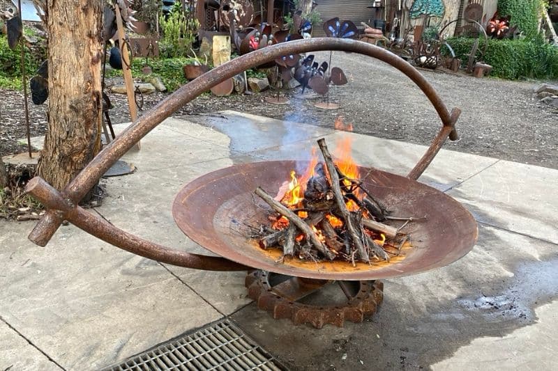 Scrap metal firepit made from recycled materials created by Tread Sculptures