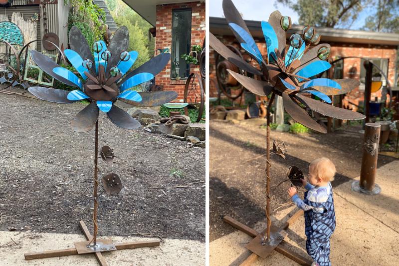 Rusty hand metal flower sculpture in Melbourne, Australia