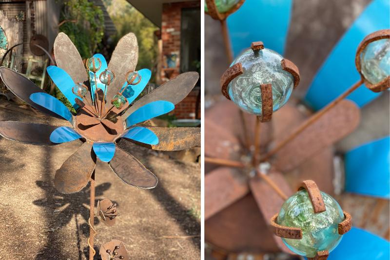 Rusty hand metal flower sculpture in Melbourne, Australia