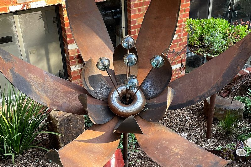This handmade flower with its relatively low and quite flat mounting will settle beautifully into a lush garden space.