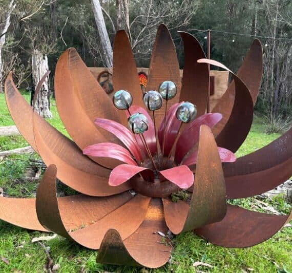A three-layer large ground flower made from reclaimed steel.