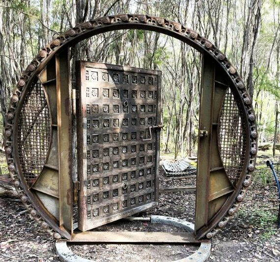 Brutalist metal gate made from reclaimed materials