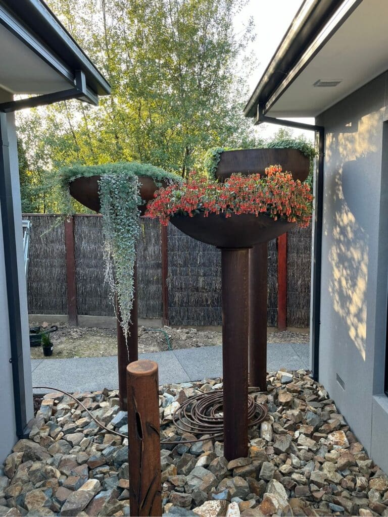 Installation of large sky gardens as a backdrop to the courtyard water feature