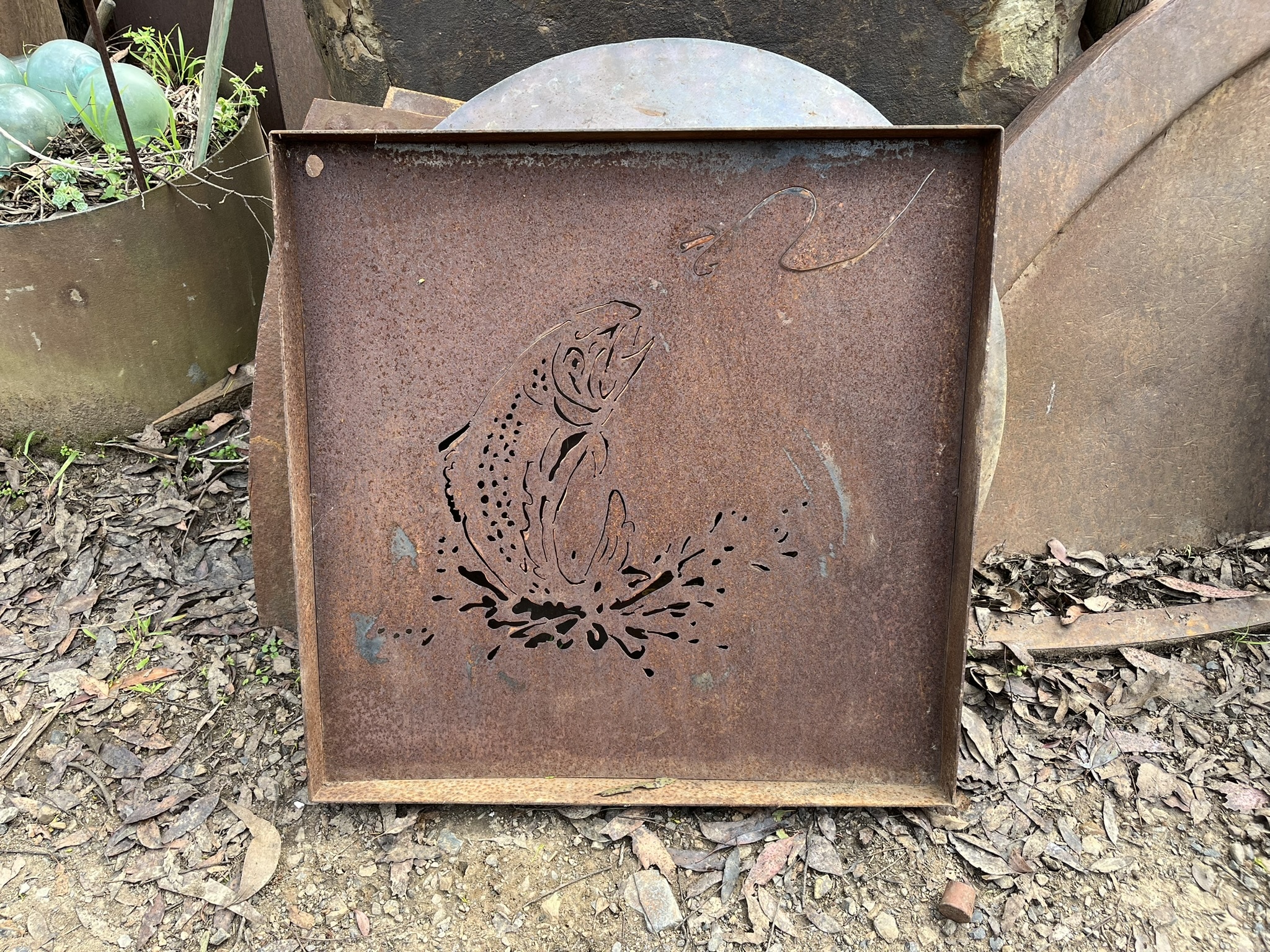 Unique recycled metal stencils for garden art installations.