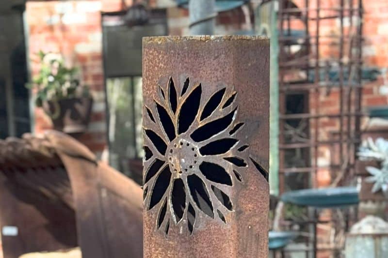 Octagonal steel slightly tapered.