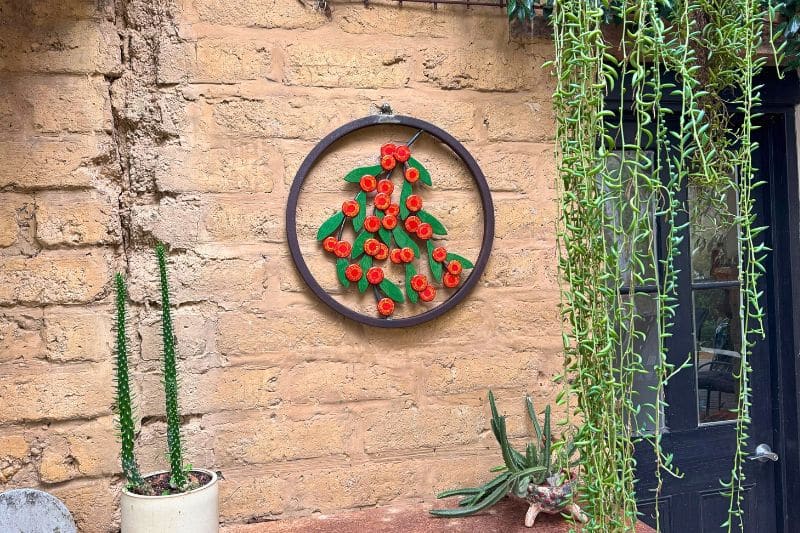 Scarlet Blaze is set in a reclaimed mild steel circle with sculpted steel branches.