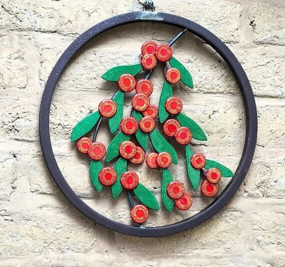 Scarlet Blaze is set in a reclaimed mild steel circle with sculpted steel branches.