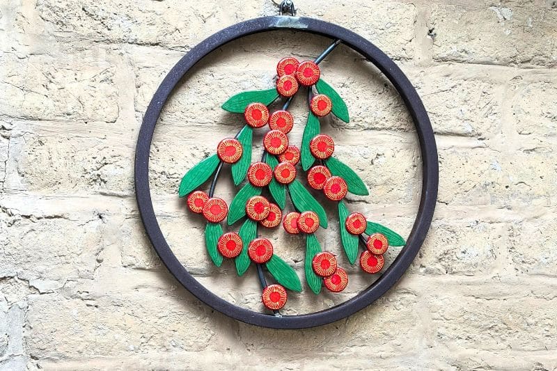 Scarlet Blaze is set in a reclaimed mild steel circle with sculpted steel branches.