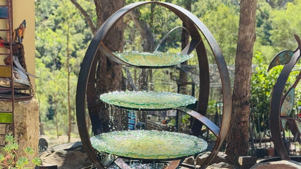 The form is cut, shaped, and welded by hand to create a strong, architectural structure that will hold and guide the movement of water.